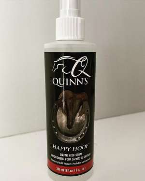 A bottle of equine hoof spray sitting on a table