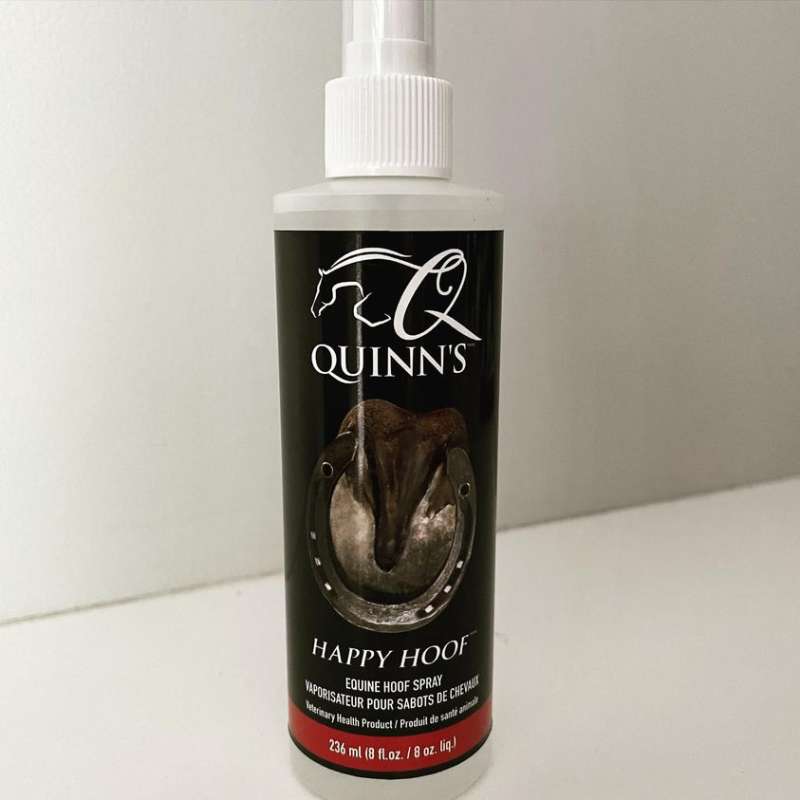 A bottle of equine hoof spray sitting on a table