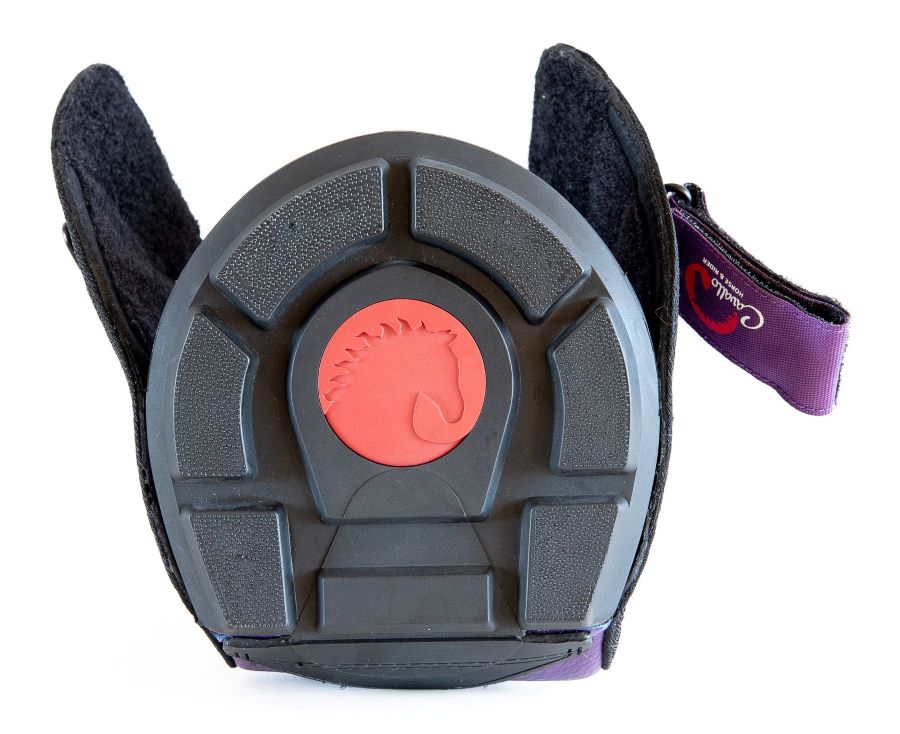 a view of the cavallo trek sole which is black plastic with a red cavallo logo in the middle.