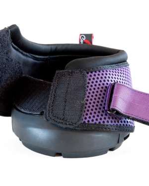 this cavallo trek hoof boot is facing forward with one velcro strap open and is a purple boot with a honeycomb mesh pattern