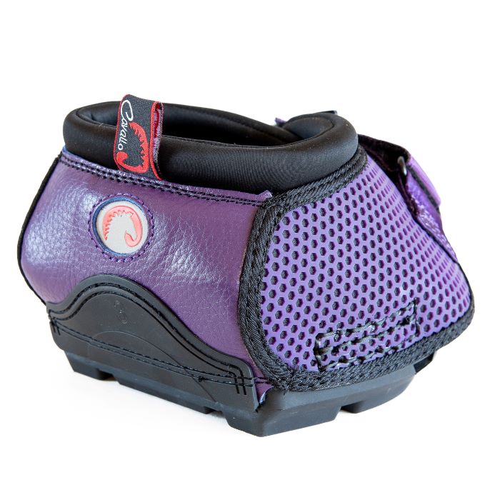 this cavallo trek hoof boot is facing backward and is a purple boot with a honeycomb mesh pattern